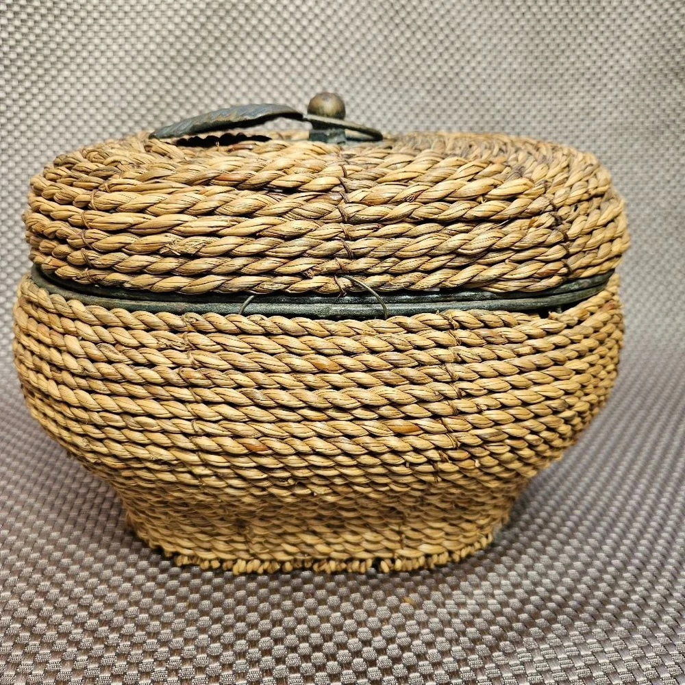 Vintage hand-woven coiled rye straw rattan wicker basket with metal leaf topper